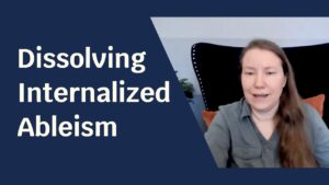 Blue background with pale skinned woman smiling at the camera. Text next to her reads: "Dissolving Internalized Ableism"