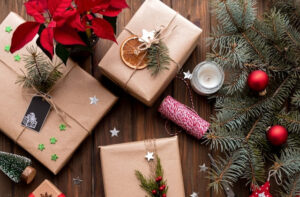 A couple of brown presents laid out on a tabled, with string and decoration around them.