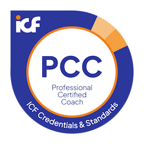 Round circle badge logo with blue rim and a thin orange inner rim. Blue letters state: "PCC Professional Certified Coach. ICF Credentials & Standards."
