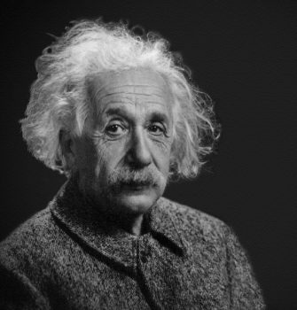 Monochromatic close-up of Albert Einstein. He is an old man with messy white hair and a moustache.